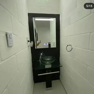 a bathroom with a sink and a mirror at Doña LoIa in San Roque