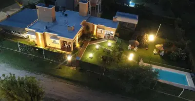 an overhead view of a house with a pool at night at Aparts Solares in San Antonio de Arredondo