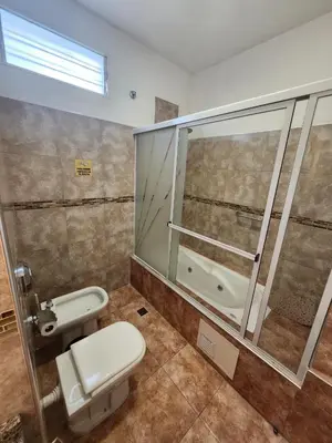 a bathroom with a toilet and a shower at Aparts Solares in San Antonio de Arredondo