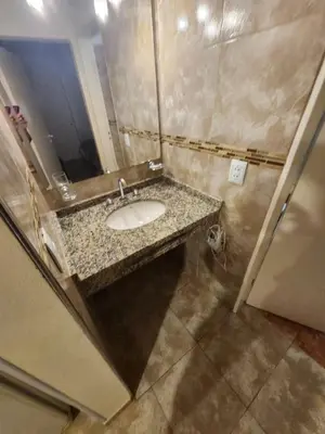 a bathroom with a sink and a mirror at Aparts Solares in San Antonio de Arredondo