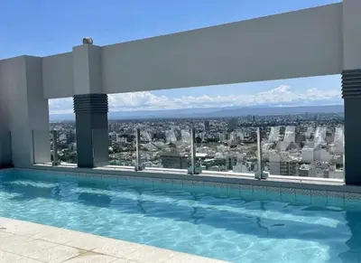 a swimming pool with a view of a city at Departamento Premium con Pileta en Altura in Cordoba