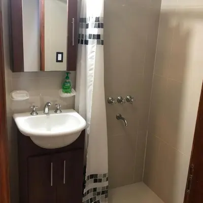 a bathroom with a sink and a shower at Miralejos 6 in Villa Carlos Paz