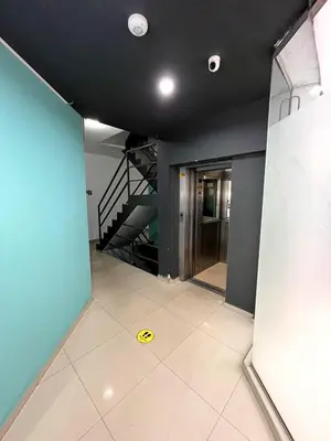 a room with a staircase and a yellow sign on the floor at depto a 1 cuadra de peatonal, luminoso con pile y cochera in Villa Carlos Paz