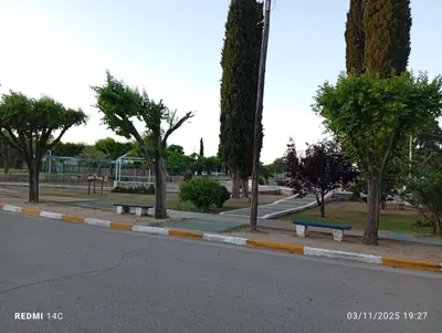 a park with benches on the side of the road at Cabañas ojo de aguila in Panaholma