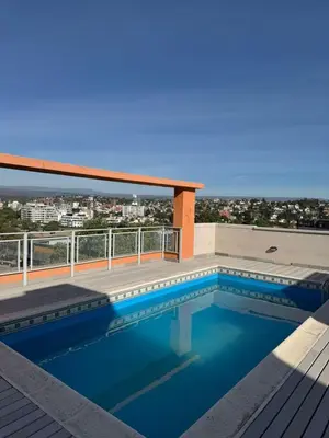 a swimming pool on the roof of a building at Casino Villa Carlos Paz in Villa Carlos Paz