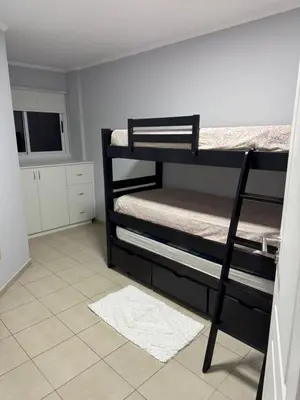 a room with two bunk beds and a television at Casino Villa Carlos Paz in Villa Carlos Paz