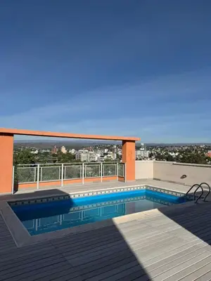 a swimming pool on the roof of a building at Casino Villa Carlos Paz in Villa Carlos Paz