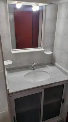 a bathroom with a sink and a mirror at La casa del pino in Mina Clavero