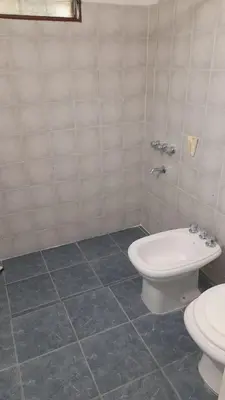 a bathroom with a toilet and a sink at La casa del pino in Mina Clavero