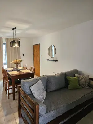 a living room with a couch and a table at Luminoso departamento in Cordoba