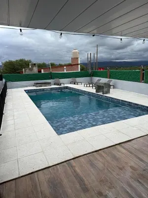 a swimming pool on the roof of a house at Altos de Las Jarillas in San Antonio de Arredondo