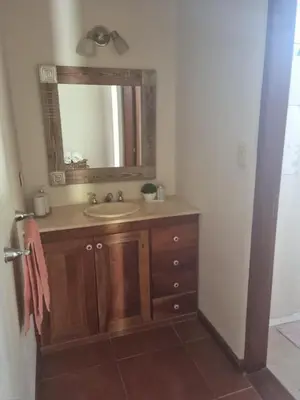 a bathroom with a sink and a mirror at Casa en Nono para 6 personas in Nono