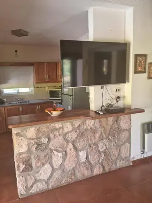 a kitchen with a stone counter top in a room at Casa en Nono para 6 personas in Nono
