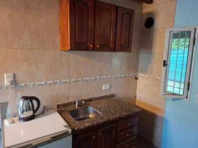 a kitchen with a sink and a counter top at Orión VGB in Villa General Belgrano