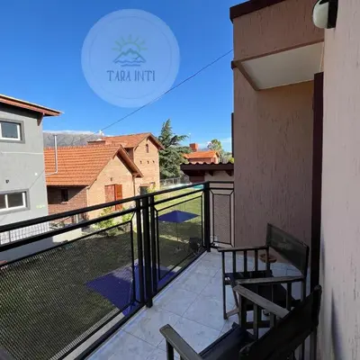 a balcony with a bench and a view at Tara Inti in Merlo