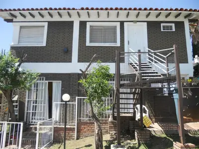 a house with a staircase in front of it at Bienvenidos a la Casa de Graciela & Carlos in Villa Carlos Paz