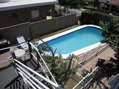 an overhead view of a large blue swimming pool at Bienvenidos a la Casa de Graciela & Carlos in Villa Carlos Paz