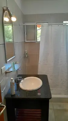 a bathroom with a sink and a shower at Habitación doble SOLO PARA DAMAS in Villa General Belgrano