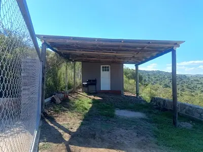 a view from the backyard of a house with a pergola at Las Piedras in Cuesta Blanca