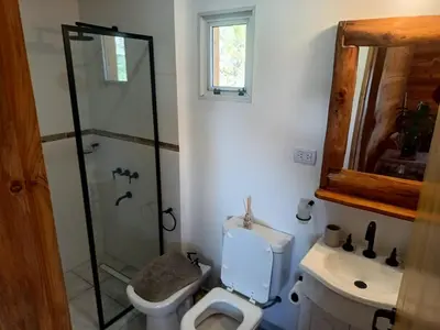 a bathroom with a shower and a toilet and a sink at Las Piedras in Cuesta Blanca