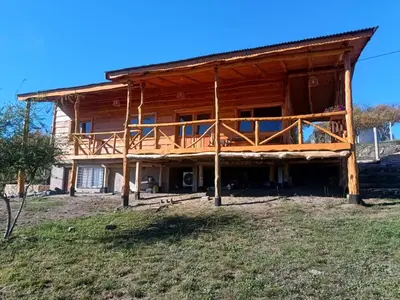 a home under construction with a wrap around porch at Las Piedras in Cuesta Blanca