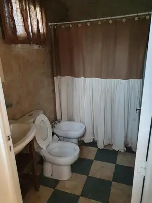 a bathroom with a toilet and a sink at Mirador de baco in Santa Rosa de Calamuchita