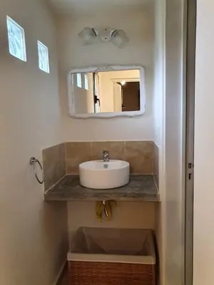 a bathroom with a sink and a mirror at Mirador de baco in Santa Rosa de Calamuchita