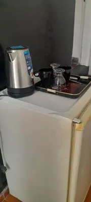 a coffee maker on top of a counter at Habitación con baño zona cucú 2 personas in Villa Carlos Paz