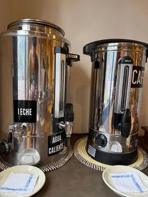 two coffee pots sitting on a counter with at Hosteria Cruz del Sur in Villa Carlos Paz
