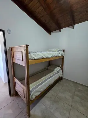 a couple of bunk beds in a room at Casa Los Reartes in Villa General Belgrano