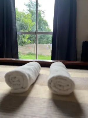a pair of towels on the floor in front of a window at Depto 168 in Santa Rosa de Calamuchita