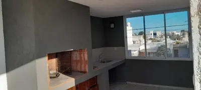 a bathroom with a fireplace and a sink and a window at calido descanso in Rio Cuarto