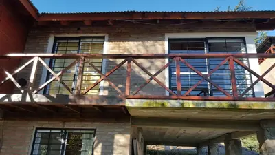 a balcony on top of a house at Abedules VGB in Villa General Belgrano