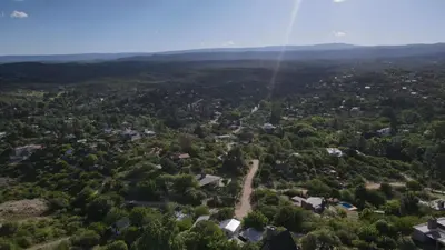 an aerial view of a small town in a forest at CASA QUINTA en ESTANCIA VIEJA in Villa Carlos Paz