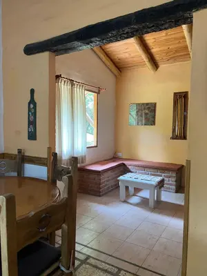 a living room with a couch and a table at Reserva Ichacuna in Los Hornillos
