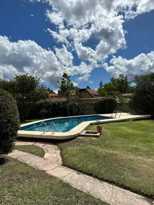 a swimming pool in the yard of a house at Casa Paz in Villa Carlos Paz