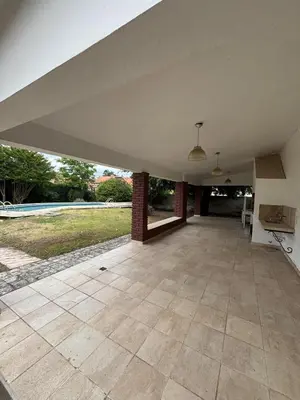 an empty living room with a large white ceiling at Casa Paz in Villa Carlos Paz