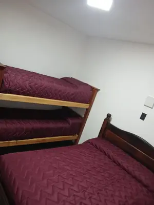 two bunk beds sitting next to each other in a room at santa rita 2 in Cordoba