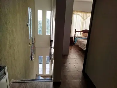 an open door to a room with a bedroom at Flor silvestre in Carpintería
