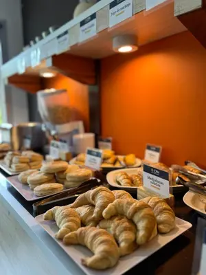 a bunch of pastries on display in a bakery at Astoria Hotel in Villa Carlos Paz