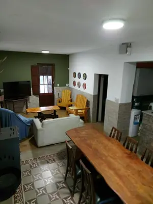 a living room with a couch and a table at Rincon de la Selva in La Calera