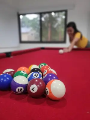 a pile of billiard balls on a pool table at Cabaña premium! in Villa Anizacate