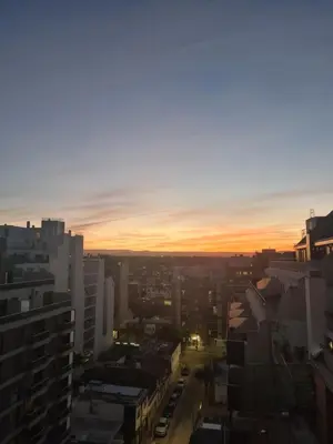 a view of a city skyline at sunset at Pent House Nueva Córdoba in Cordoba