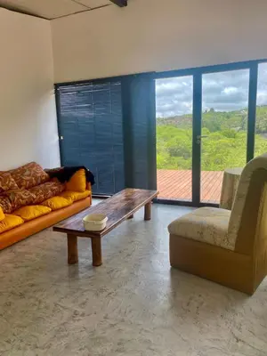 a living room with a couch and a coffee table at Monte Adentro in Dique Nivelador