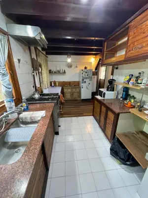 a kitchen with a sink and a counter top at Casa Familiar in La Cumbrecita
