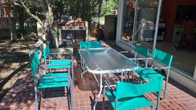 a group of chairs and a table and chairsitures at Bosquesito in Mina Clavero