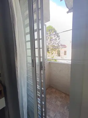 a door leading into a room with a window at Departamento moderno y luminoso in Cordoba