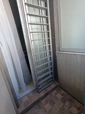 a glass door with a window in a room at Departamento moderno y luminoso in Cordoba