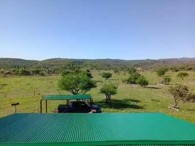 a green tarp on top of a golf cart at Cabaña Elun in Panaholma