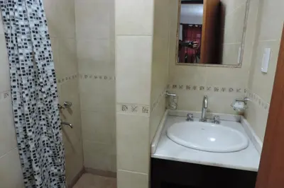 a bathroom with a sink and a shower at Cielo Azul in Santa Rosa de Calamuchita